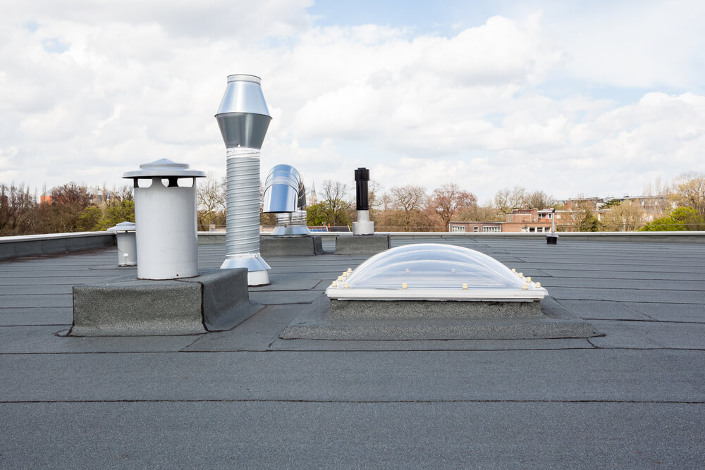 A modified bitumen roof installed around skylights and other penetrations