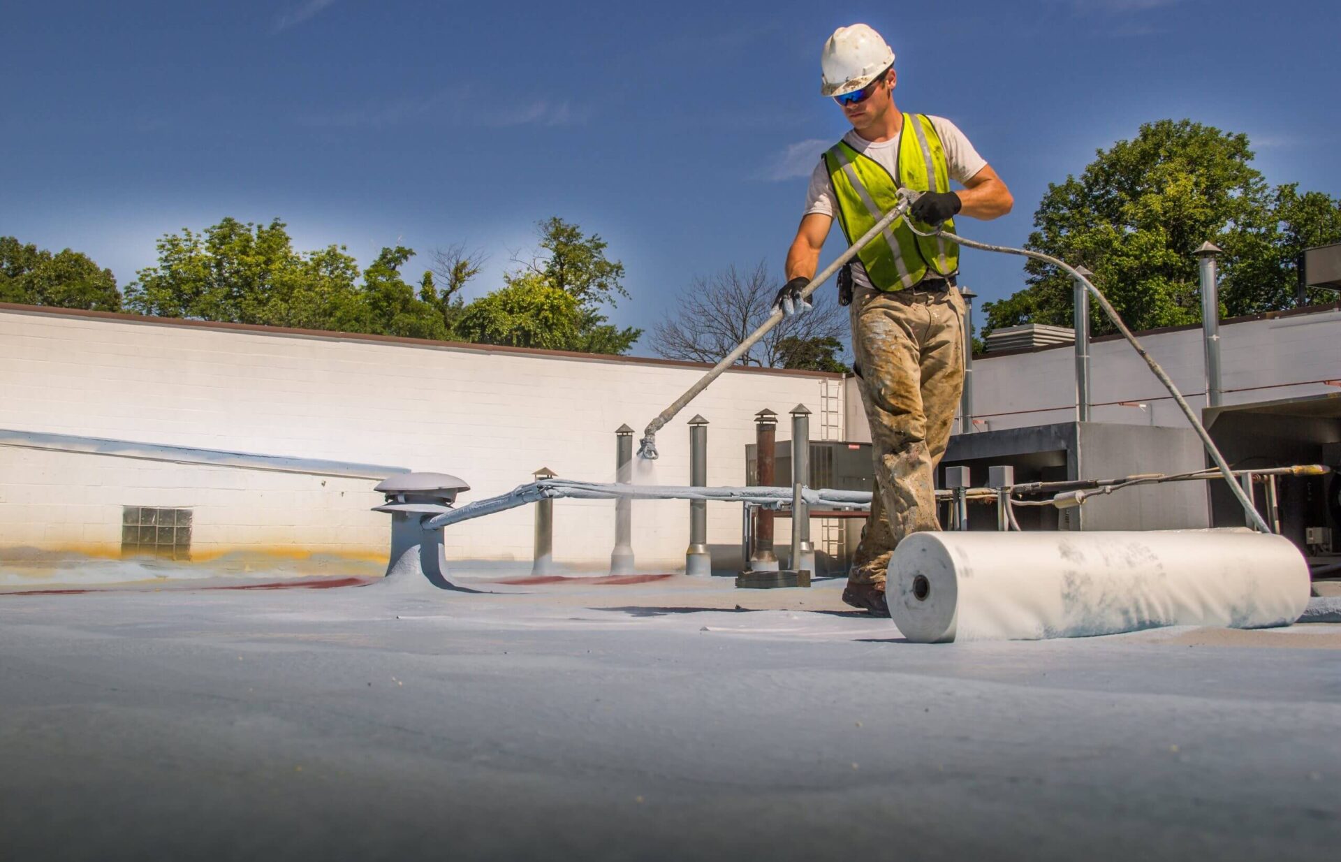 commercial-roofing-coating-on-a-large-building Commercial roof coating improving a commercial building’s efficiency