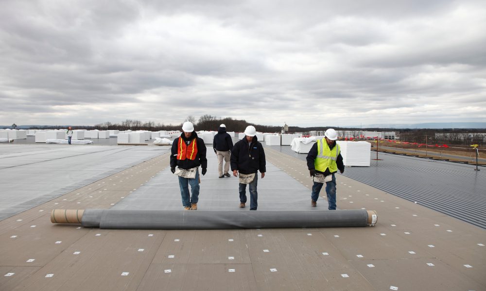 crews-working-on-single-ply-tpo-commercial-roofing Crews working on Single Ply TPO Commercial Roofing