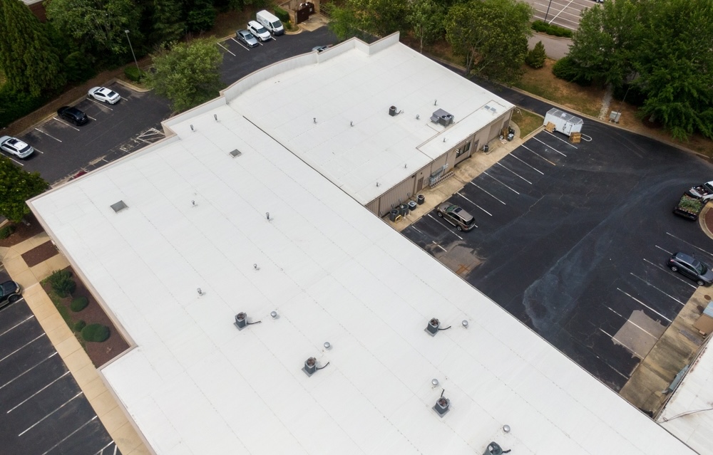 Commercial,Flat,Tpo,Roof,Drone,Inspection:,New,And,Old,Roofs, Commercial building benefiting from energy efficient single-ply roofing