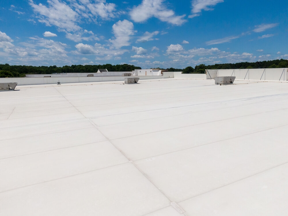 A commercial single-ply roofing system improving a building’s efficiency
