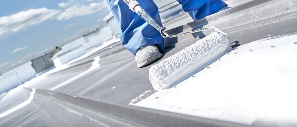A commercial roof flat roof coating being applied