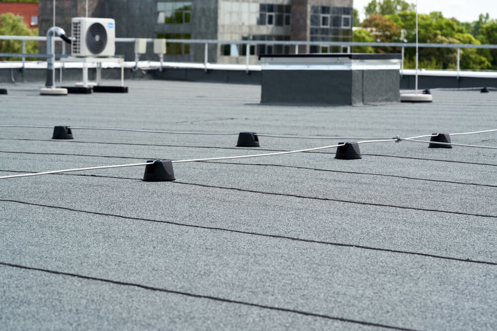 A new modified bitumen roof installed on a commercial rooftop