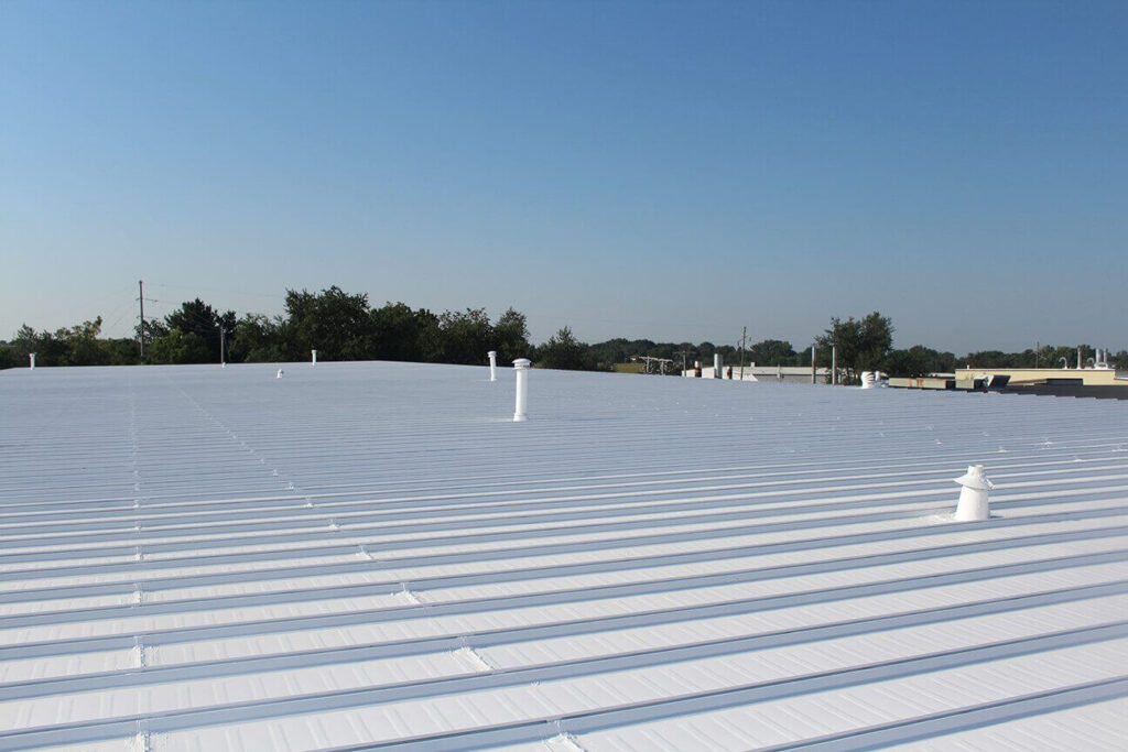 A white silicone roof coating on a metal roof