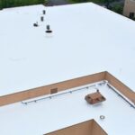 Commercial roof coating application on a flat roof in Chicago, IL