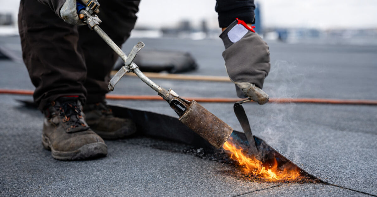 Commercial roof repair work on flat roofing membrane system