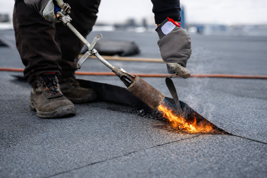 commercial-roof-repair-modified-bitumen-torch-application-99 Commercial roof repair using torch-applied modified bitumen membrane on flat roof