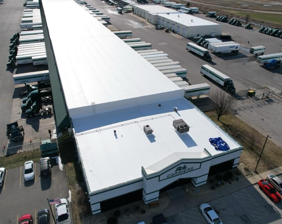 commercial-roof-overlay-industrial-building-99 commercial flat roof overlay system installed on large industrial warehouse building