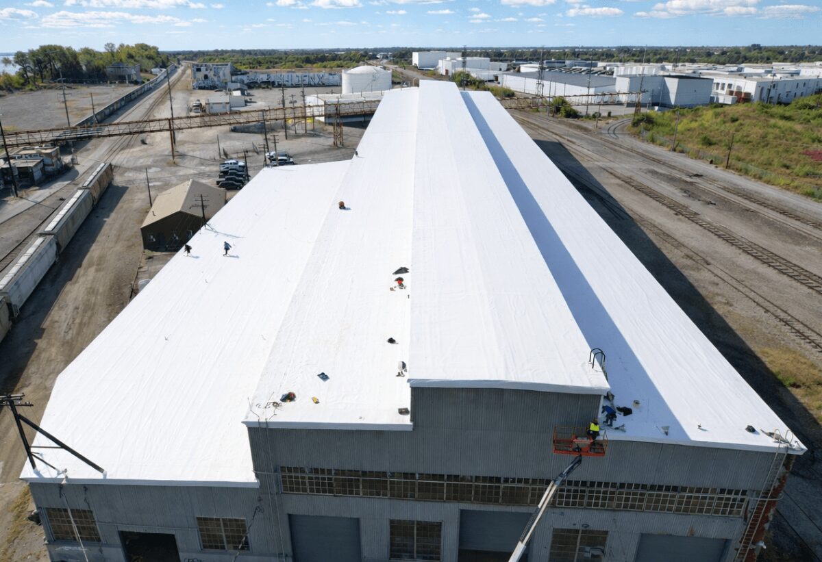industrial-tpo-roof-installation-large-facility-98 Large industrial facility with newly installed white TPO roofing system