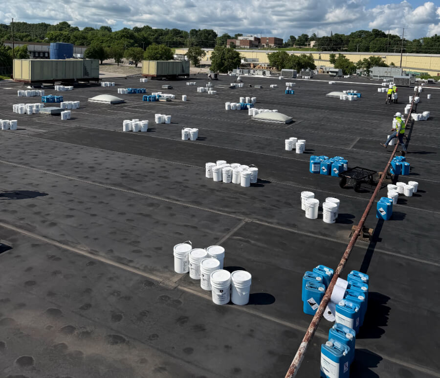 manufacturing-facility-flat-roof-restoration-99 Commercial roof restoration project on manufacturing facility flat roof