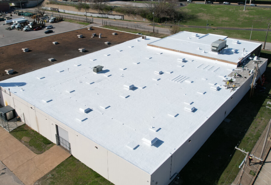 manufacturing-facility-white-roof-coating-system-99 White commercial roof coating system on manufacturing facility flat roof