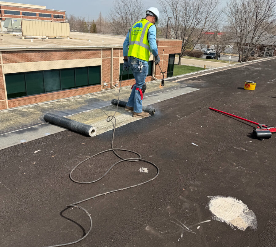 commercial-plaza-flat-roof-system-99 Flat roofing system on a commercial shopping center with rooftop HVAC equipment