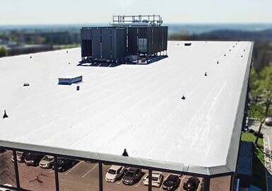 commercial-tpo-roofing-system-99 Commercial TPO roofing system installed on a flat commercial building